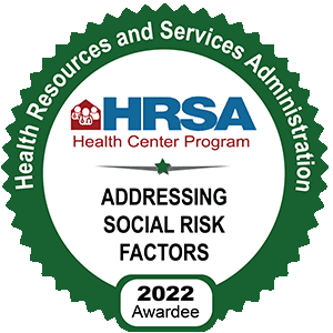 Award badge: Health Resources and Services Administration Health Center program: Addressing Social Risk Factors 2022 Awardee